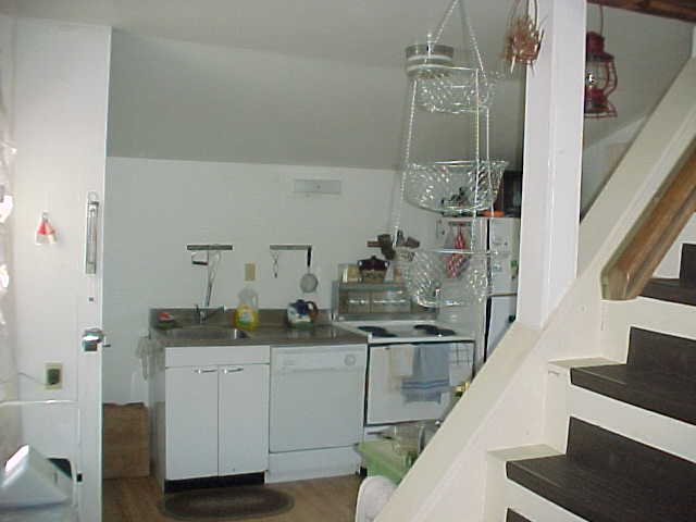Kitchen, with stainless steel sink, dishwasher, electric stove, refrigerator with ice maker, and microwave oven