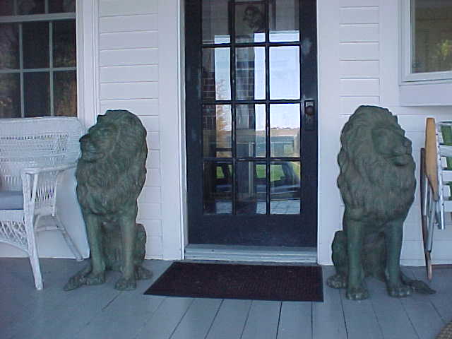 Bronze Belgian lions welcome you to the main entrance