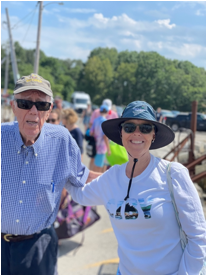 A person and person posing for a picture
Description automatically generated